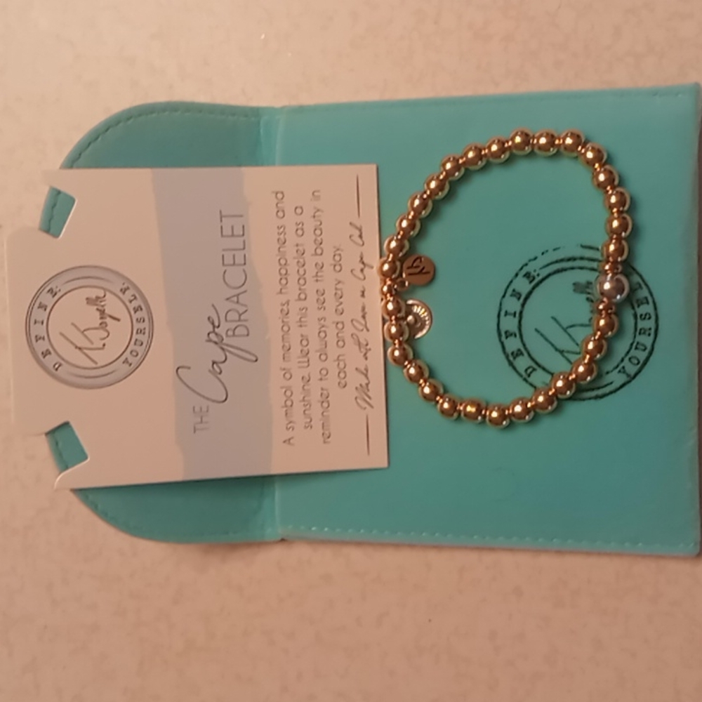 Cape bracelet, Gold filled with Silver ball.